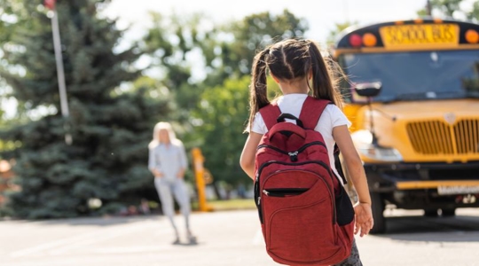 young girl going back to school